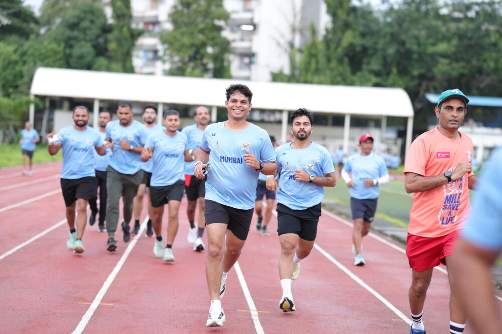 Mumbai team runners smiling mid-run