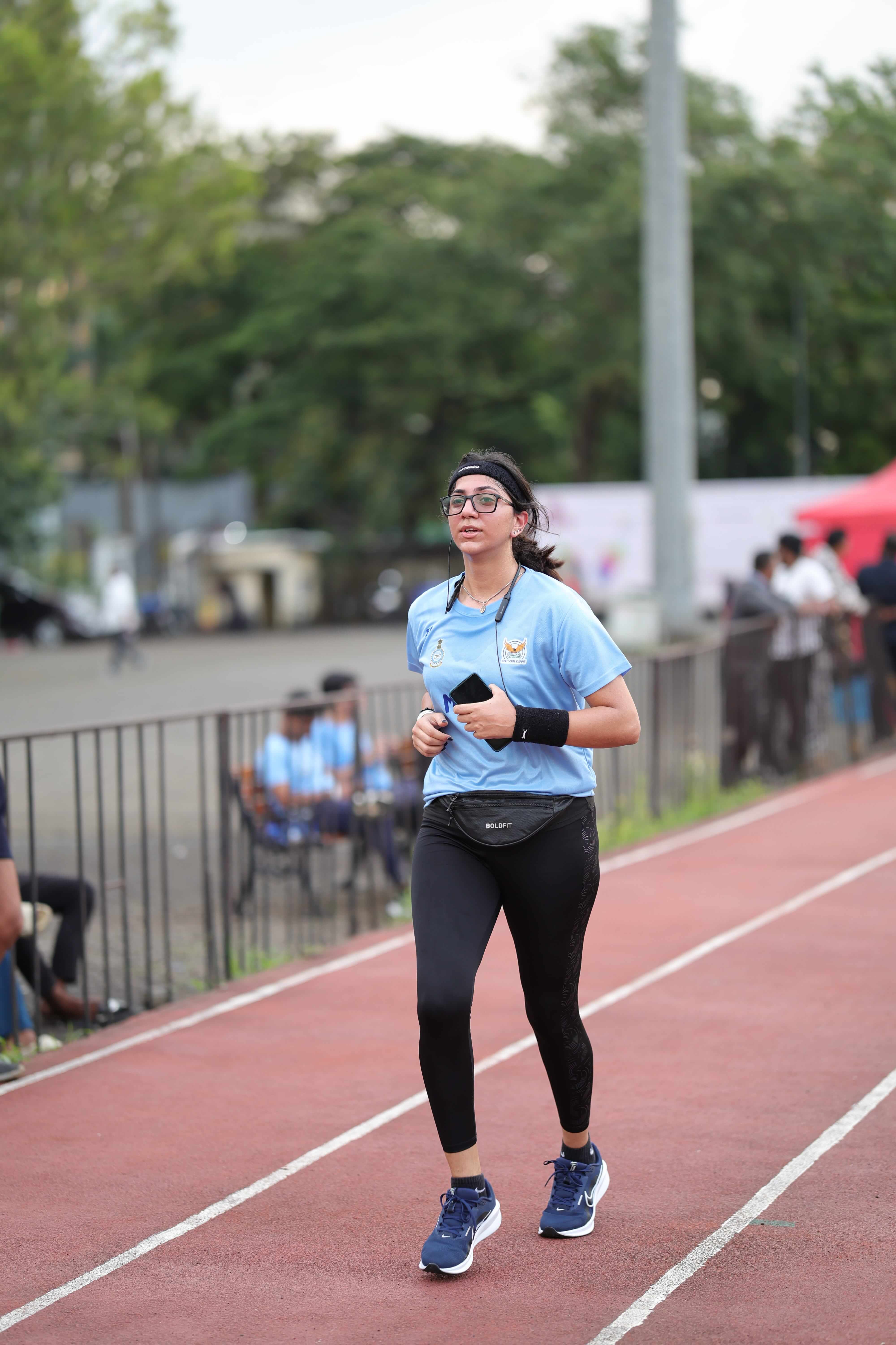 Female athlete running on the track